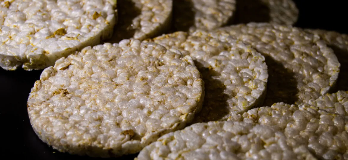 corn crisps prepared to be eaten on a black background by an athlete or a person trying to lose weight with shades